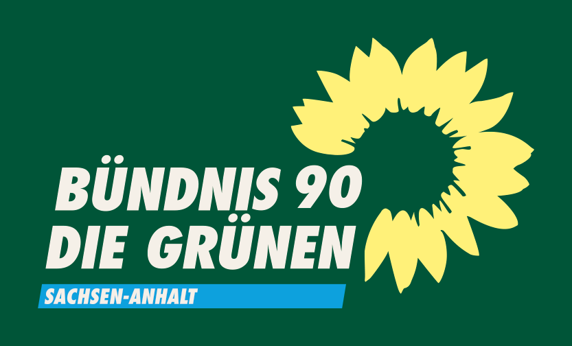 Weißer Schriftzug „BÜNDNIS 90 DIE GRÜNEN“ auf dunkelgrünem Hintergrund neben einer gelben Sonnenblume, darunter ein blauer Balken mit der Aufschrift „SACHSEN-ANHALT“.